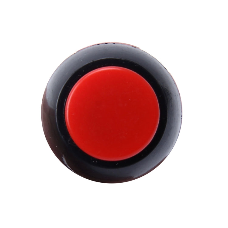 Red circular push button with black surround and flat 2-pin base