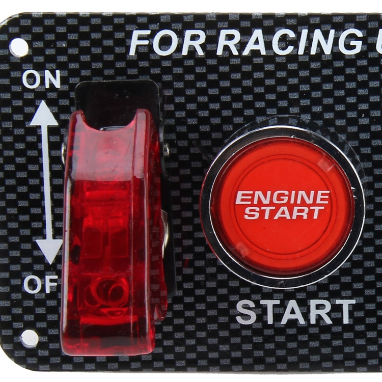 Carbon fiber ignition switch panel detail with red engine start push button and ON/OFF rocker