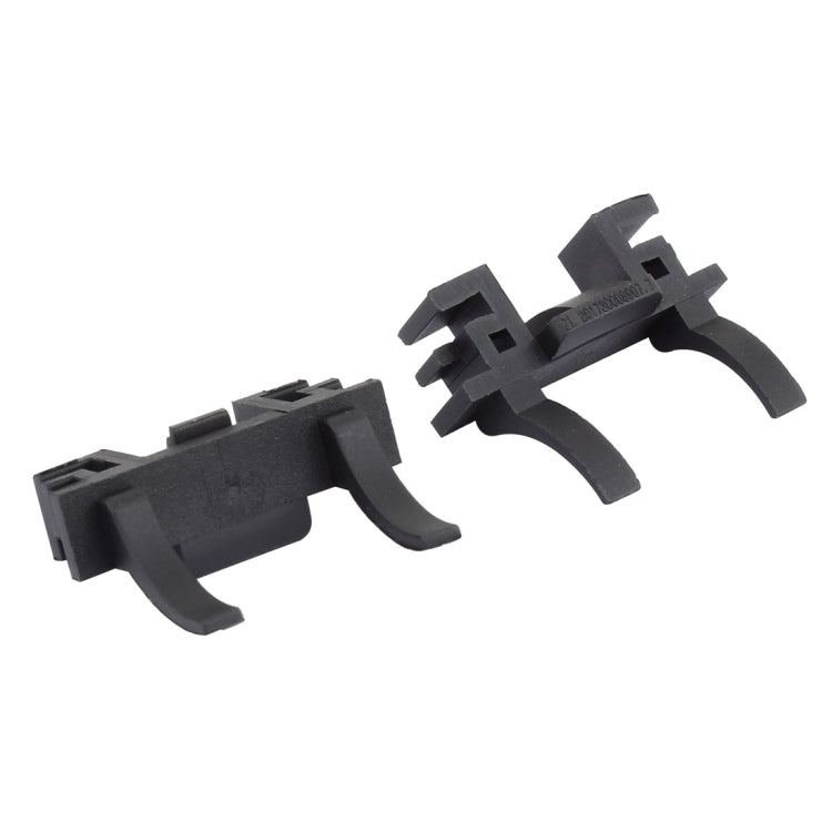 Pair of black headlight bulb adapter retainers with snap-fit bracket tabs