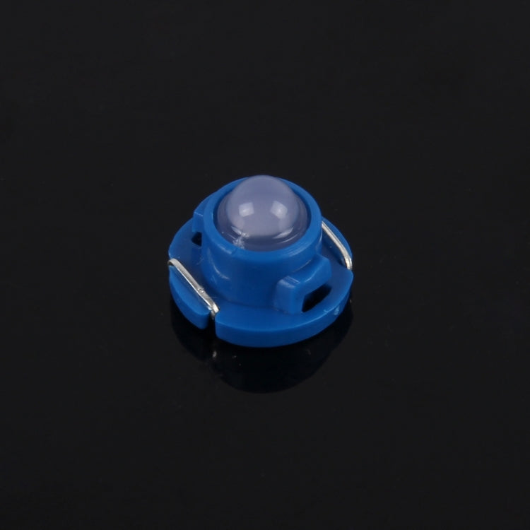 Blue T4.7 wedge LED bulb close-up with clear round lens and side metal contacts