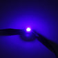 Blue T4.7 wedge LED bulb emitting a bright blue light for vehicle dashboard indicators