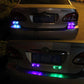 LED warning light bars on car rear, flashing purple and green/blue