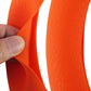 Orange rubber steering wheel cover close-up showing crocodile texture embossing