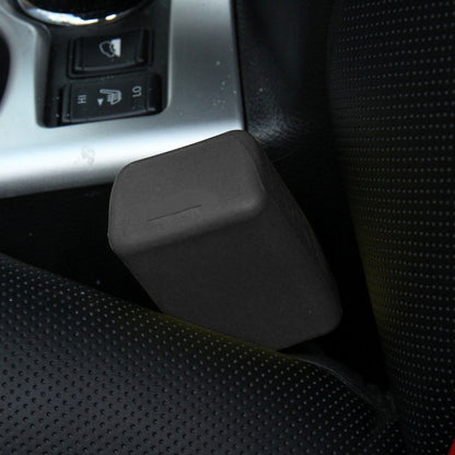 Black rubber car seat belt buckle lock cover on car seat