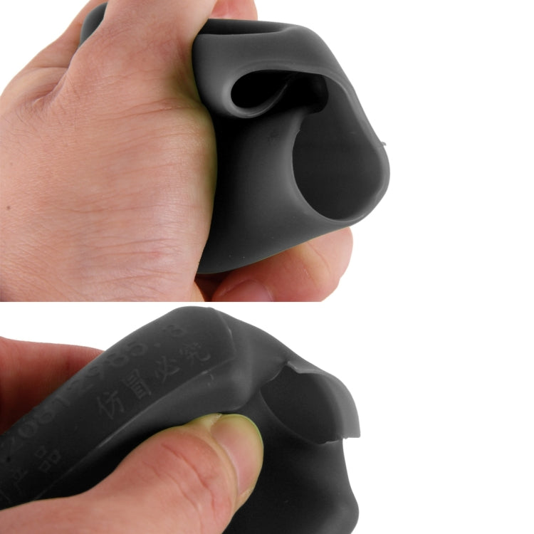 Black rubber buckle lock cover held in hand, close-up