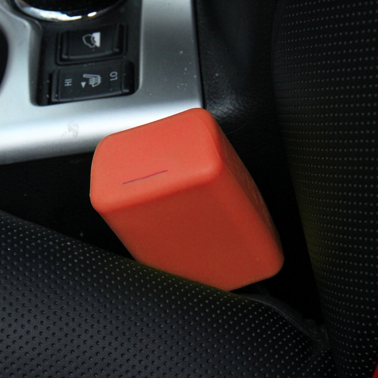 Orange rubber car seat belt buckle lock cover on car seat
