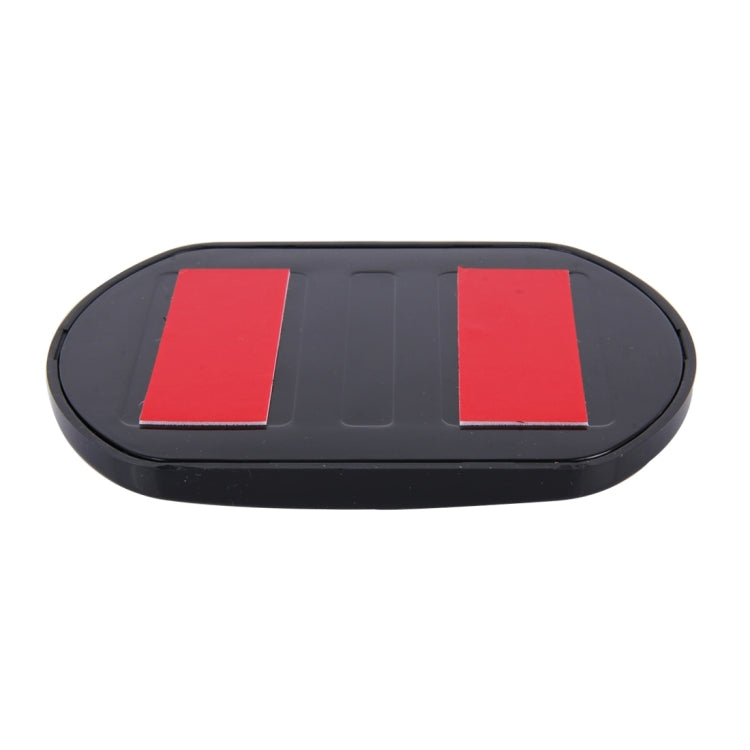 Black oval blind spot mirror back with two red rectangular sections