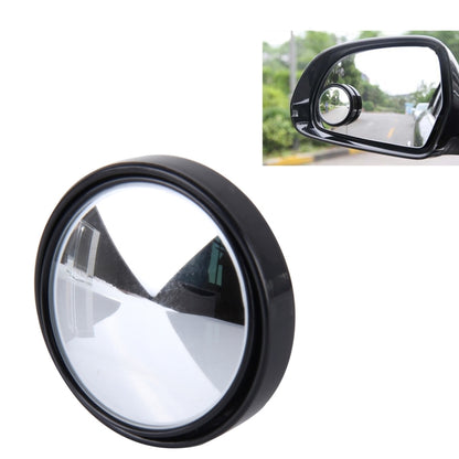 Black round blind spot car mirror with wide-angle reflective glass in a thick bezel