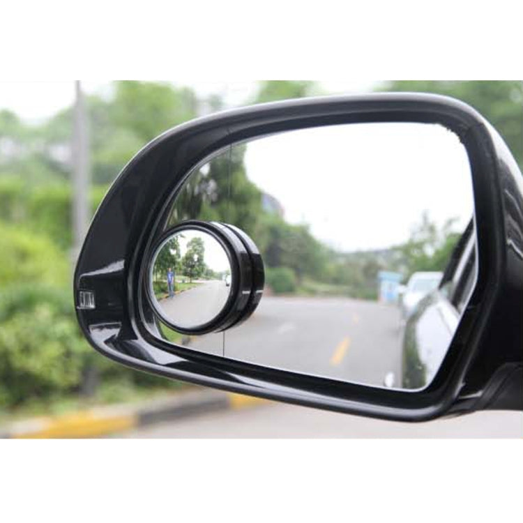 Black wide-angle blind spot car mirror mounted on the vehicle side