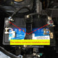 Brass battery terminal clamps installed at car battery posts, positive and negative