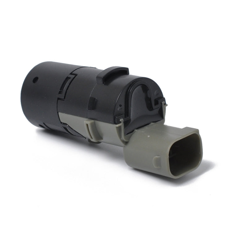 Car parking reversing radar sensor probe side view, black housing with gray front plug