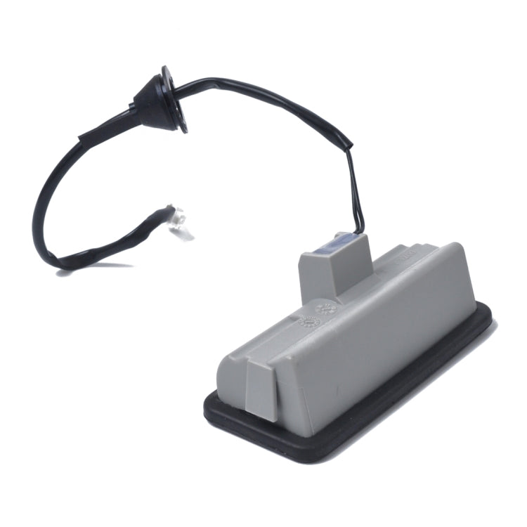 Gray tailgate release switch assembly with black cable and connector plug