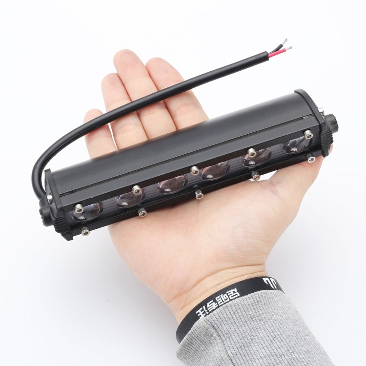 8-inch LED light bar with power lead, shown held in a hand for size