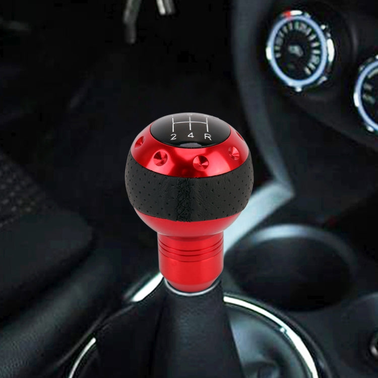 Red gear shift knob with black perforated grip and H-pattern shift letters