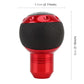 Red gear shift knob with black perforated grip and numbered shift panel