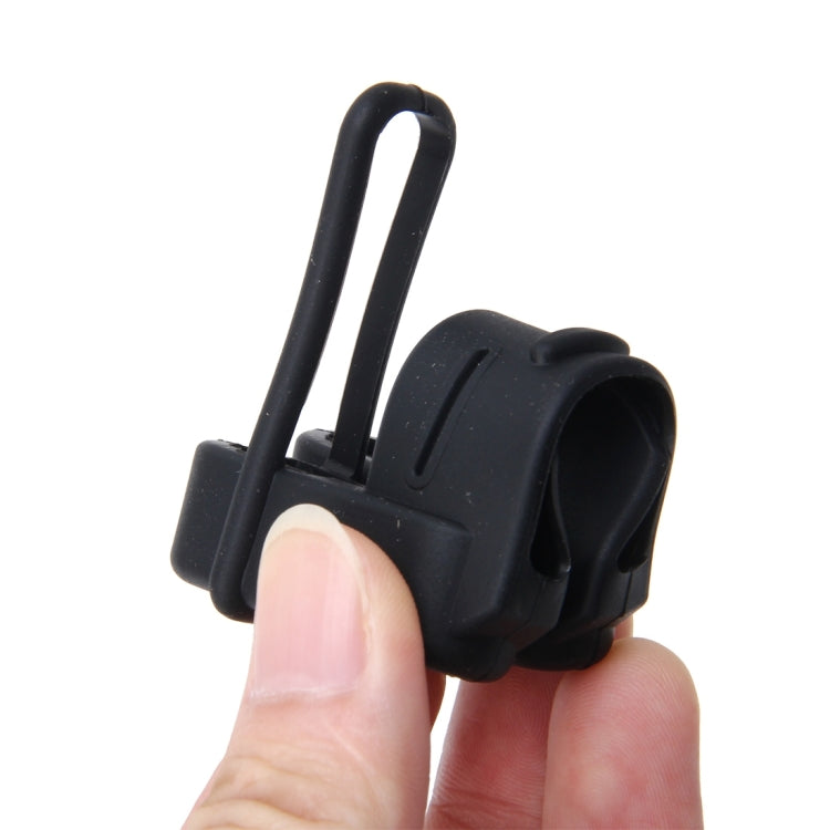 Black seat belt buckle plug cover case held by hand, molded protective frame