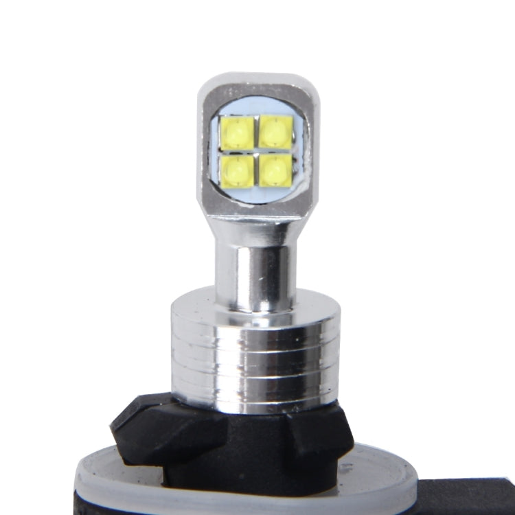 Car fog light LED bulb close-up, silver metal base and four yellow LED chips