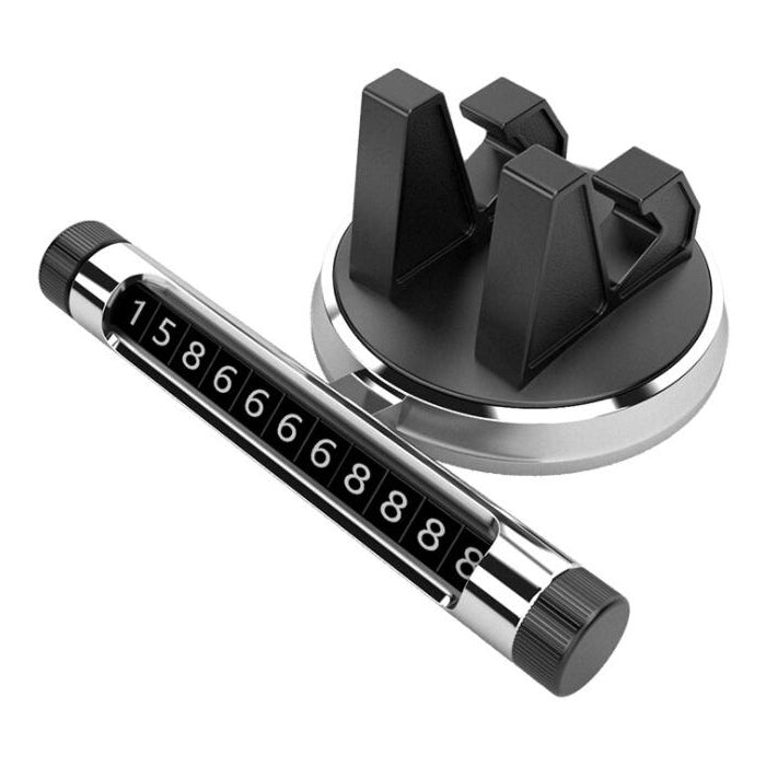 Silver car dashboard temporary parking number card holder with black privacy cover and digits.