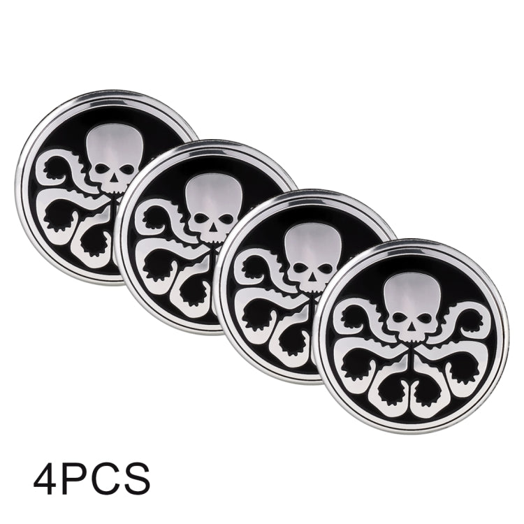 Four round wheel hub stickers with skull-and-crossbones style design