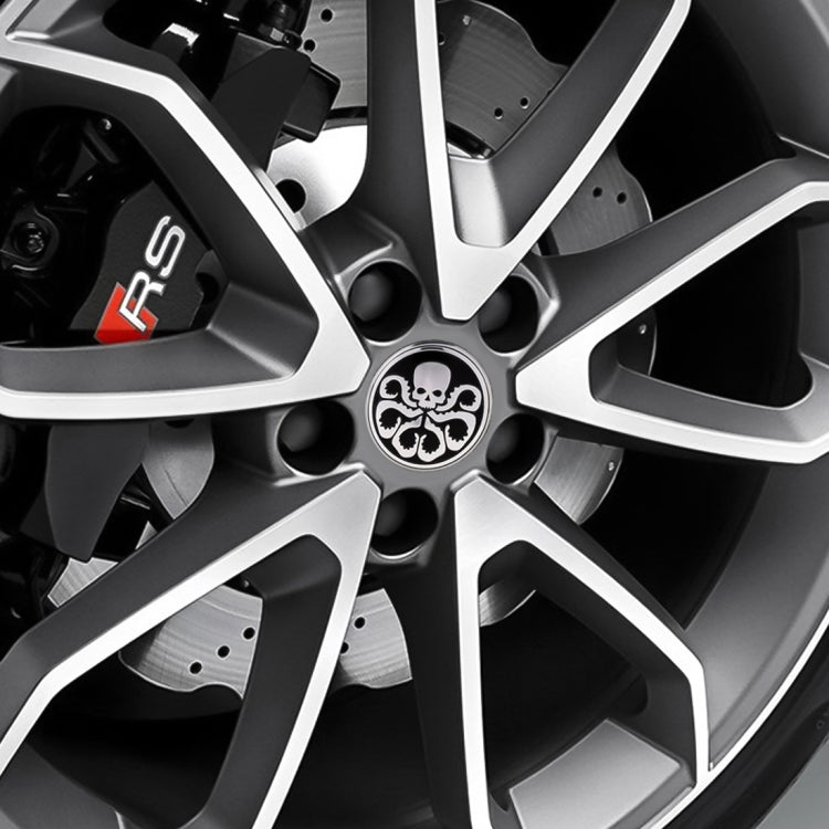 Skull wheel hub decorative sticker centered on alloy wheel