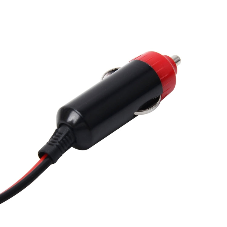 12V car cigarette lighter plug close-up: red insulator and metal prong on black housing