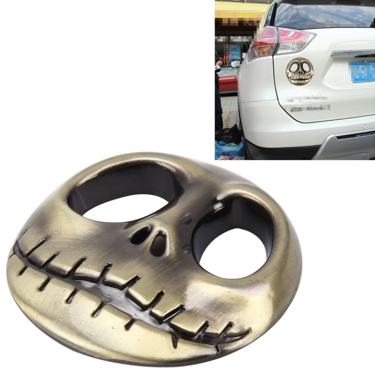 3D metal skull auto sticker with open eye holes and tooth row, gold finish