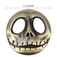 3D metal skull auto sticker, gold finish with two round eye cutouts and engraved teeth