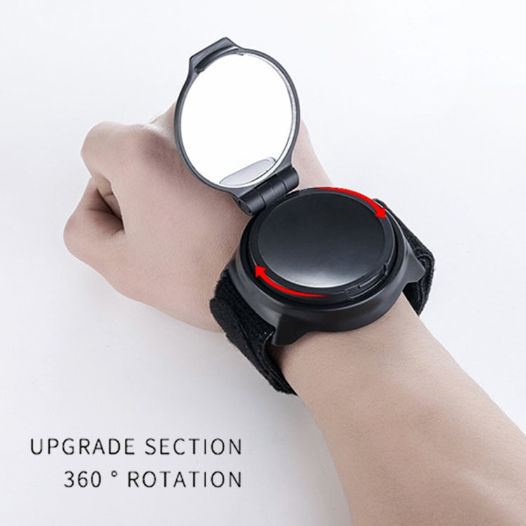Wrist strap rear view bike mirror showing rotating oval back lens position