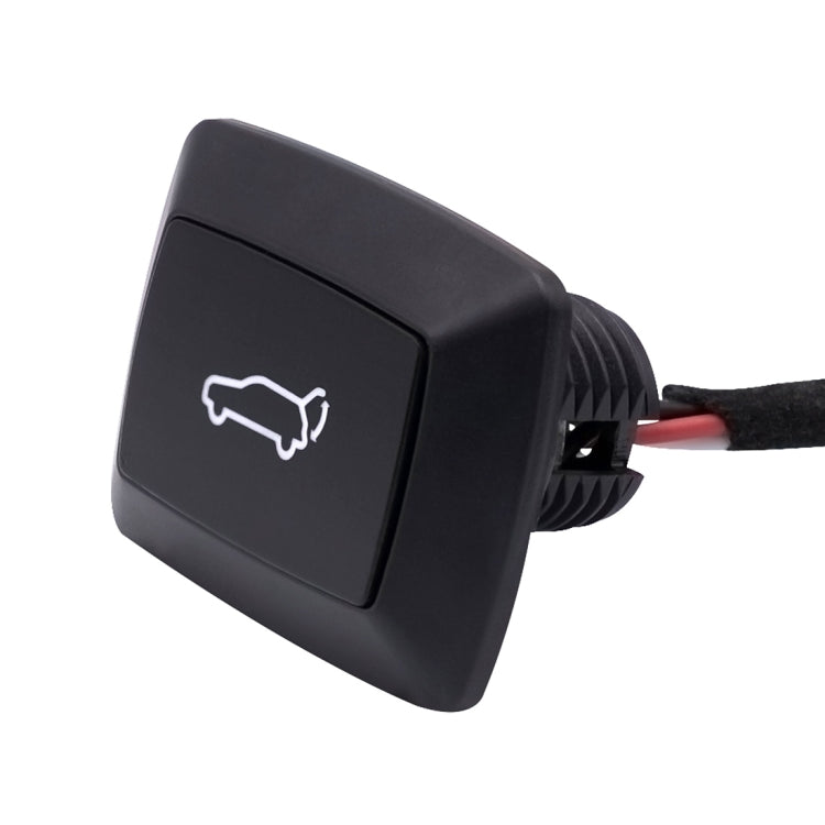 Car trunk release switch with red wire leads and black housing, white icon