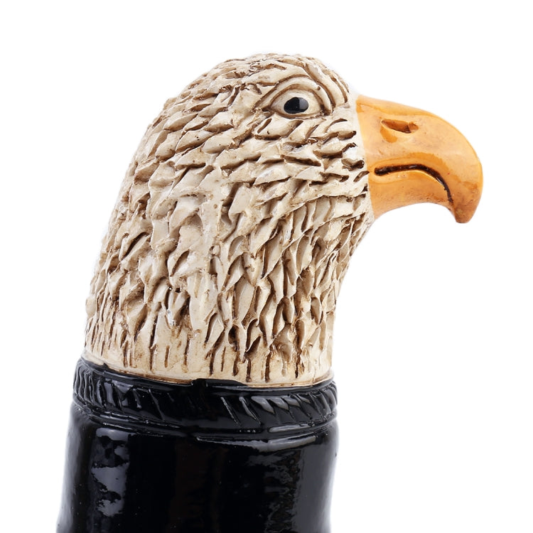 Close-up eagle topper on gear shift knob, tan textured head with orange beak