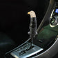 Installed gear shift knob with eagle topper, black glossy body and tan textured head