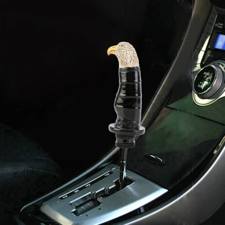 Installed gear shift knob with eagle topper, black glossy body and tan textured head