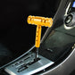Universal car gear shift knob with T-shaped handle, gold finish, installed in car interior
