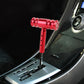 Red T-shaped car gear shift knob with threaded metal head and mounting stem