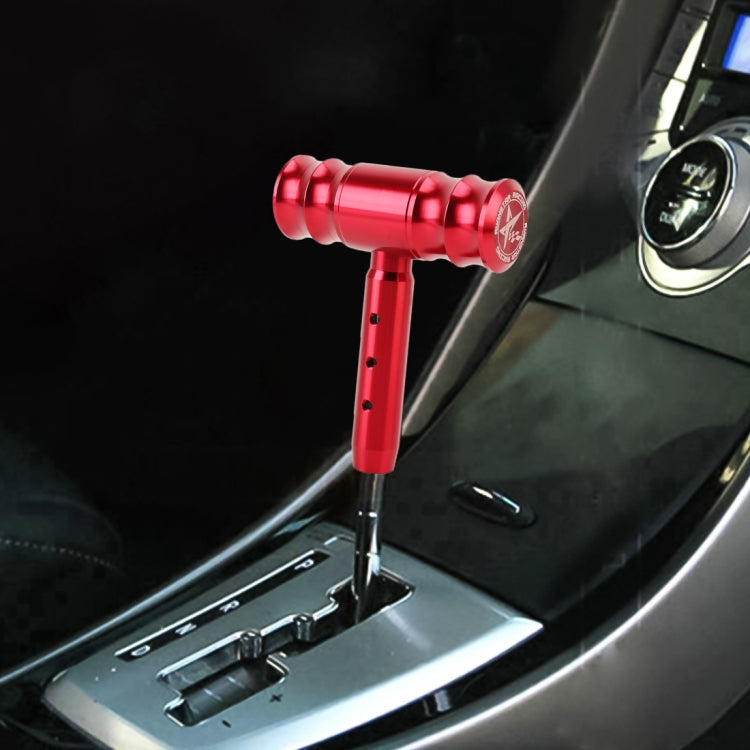 Red T-shaped car gear shift knob with threaded metal head and mounting stem