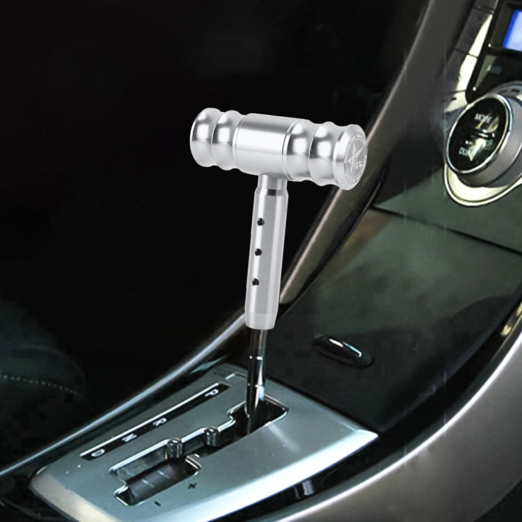 Silver T-shaped car gear shift knob with threaded metal head and mounting stem