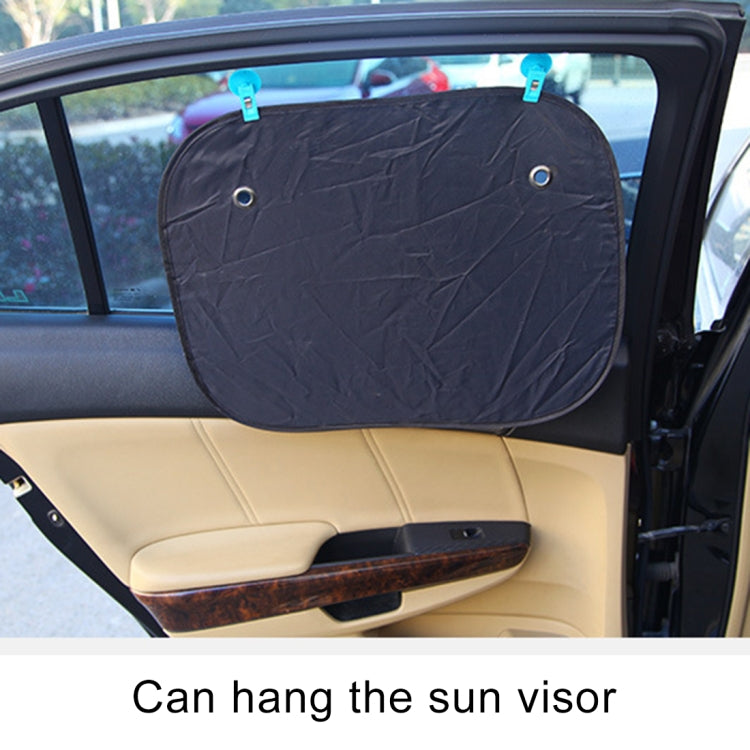 Black suction cup clip holding a sun visor panel in a car