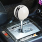 White resin gear shift knob with black stripe bands, silver base, and 5-speed markings