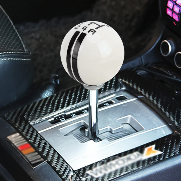 White manual 5-speed resin gear shift knob with black stripe bands and number markings