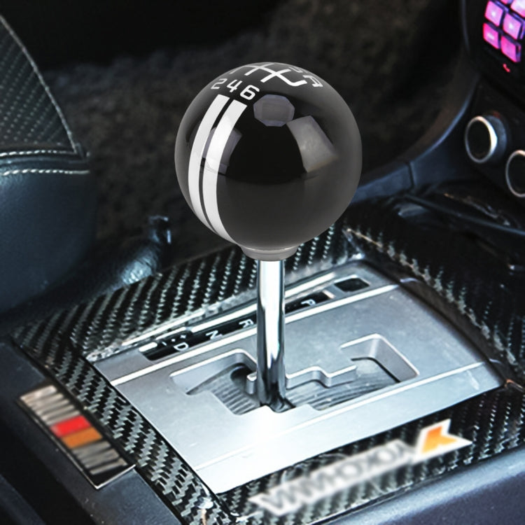 Black ball-style gear shift knob with white stripe and 246 marking