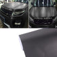 Dark gray metallic matte car wrap vinyl sheet, rolled edge on white background.