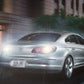 Car front with bright white LED headlight glow