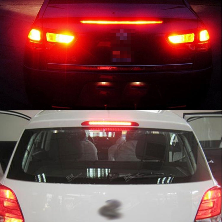 Car rear with red brake and amber turn LED lights illuminated