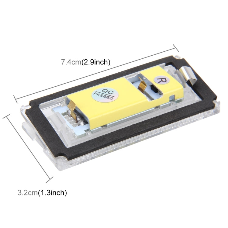 License plate light module with yellow QC sticker and mounting clips