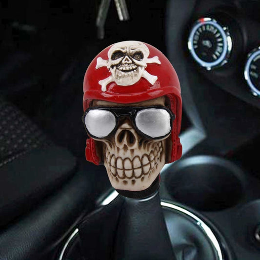 Skull-shaped gear shift knob cover, red helmet with white skull and silver goggles