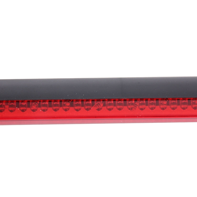 Close-up of red LED third brake light strip with illuminated bulbs