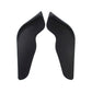 Pair of black front bumper spoiler lip splitters, curved ABS pieces on white background