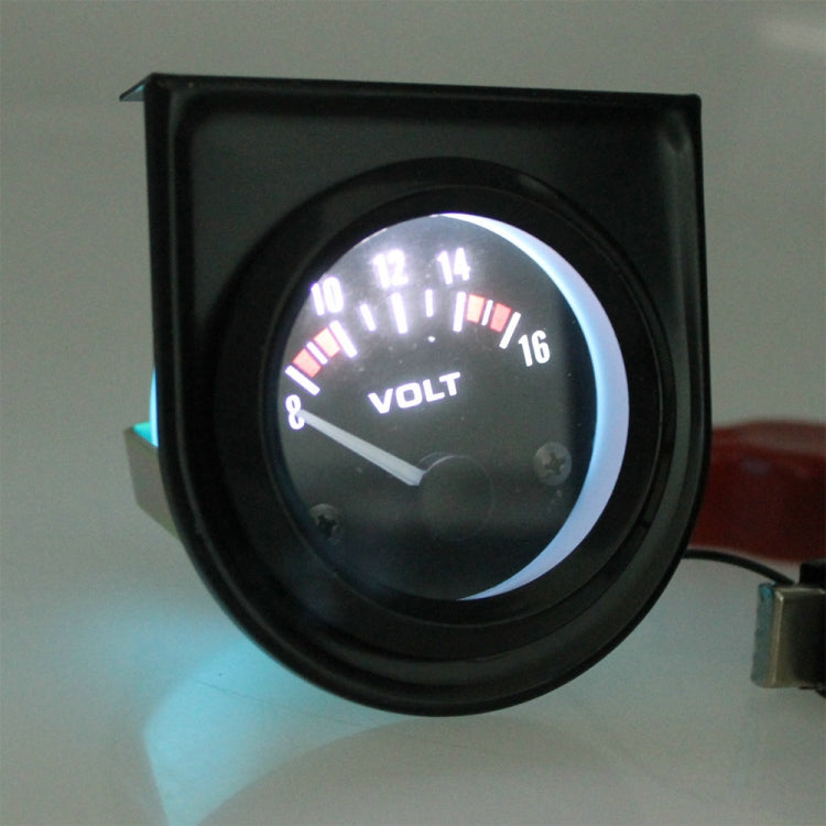 Illuminated black car voltmeter gauge showing VOLT and 8–16 scale