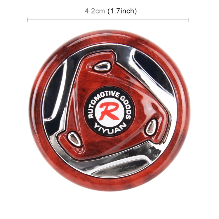 Red steering wheel spinner knob with center logo and silver outer rim