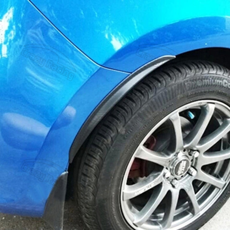 Black rubber fender guard strip along wheel arch beside the tire